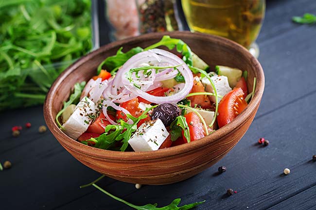 greek-salad-with-fresh-tomato-cucumber-red-onion-basil-feta-cheese-black-olives-italian-herbs
