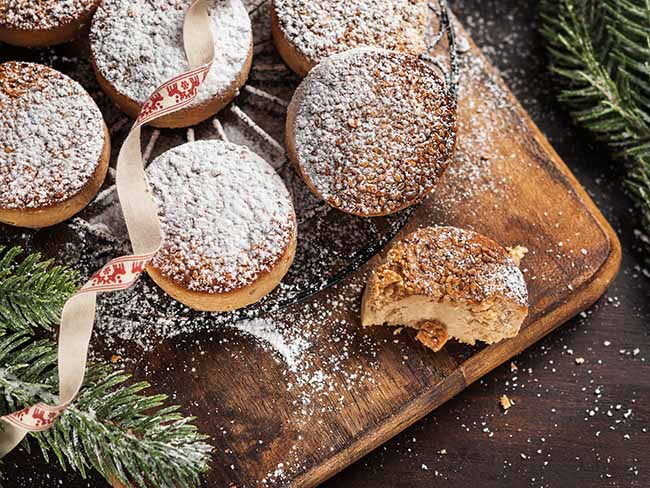 traditional-christmas-cookies-with-almonds-sesame-dark-wooden-background-with-copy-space
